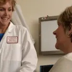 A doctor speaks with a patient during a consultation