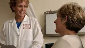 A doctor speaks with a patient during a consultation