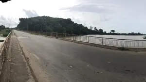 A road in Grand-Lahou bordered by a river