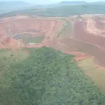 Aerial view of an open-pit gold mine in Africa, illustration
